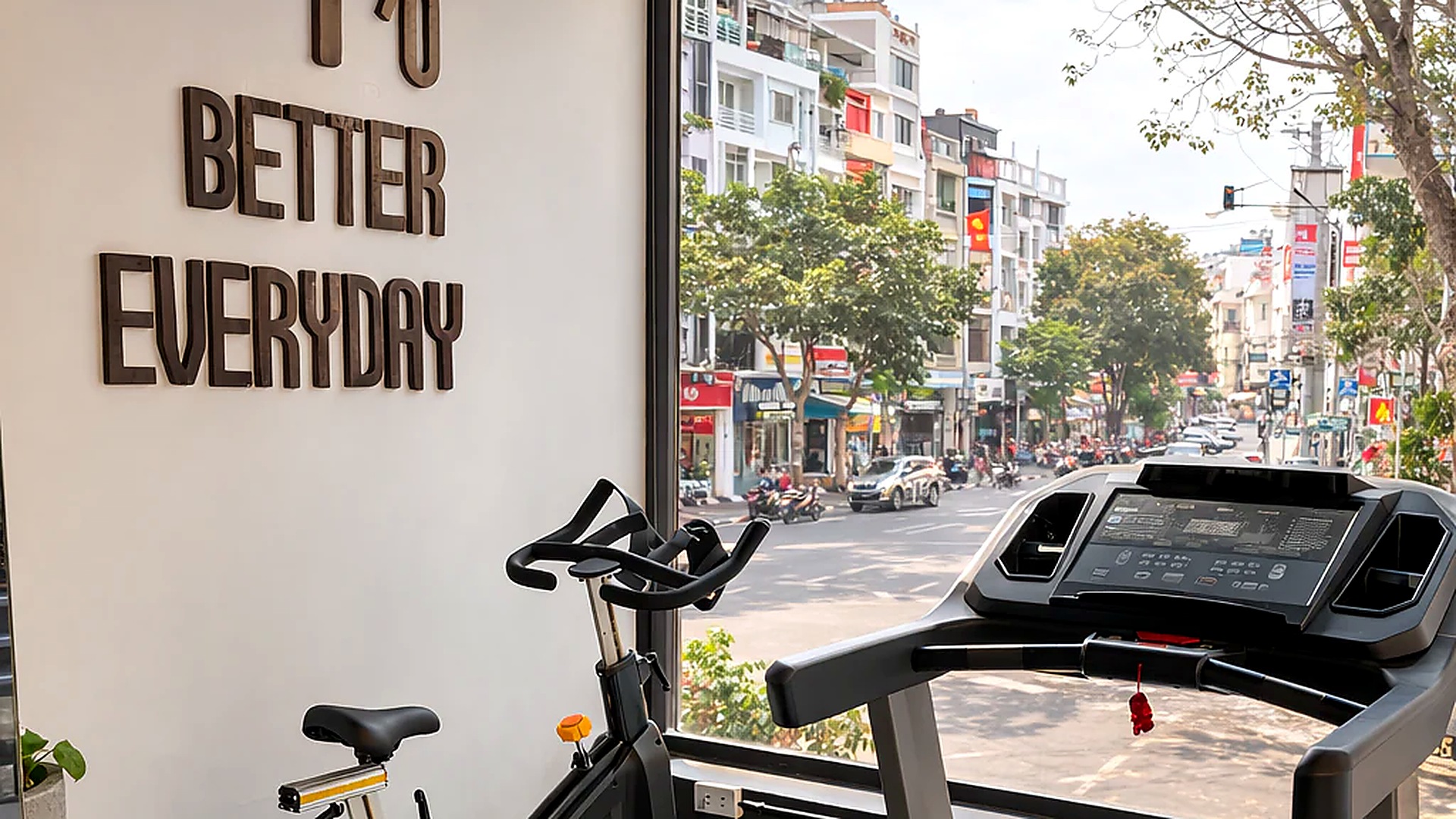 Phòng gym khách sạn 4 sao với máy chạy bộ và xe đạp tập.