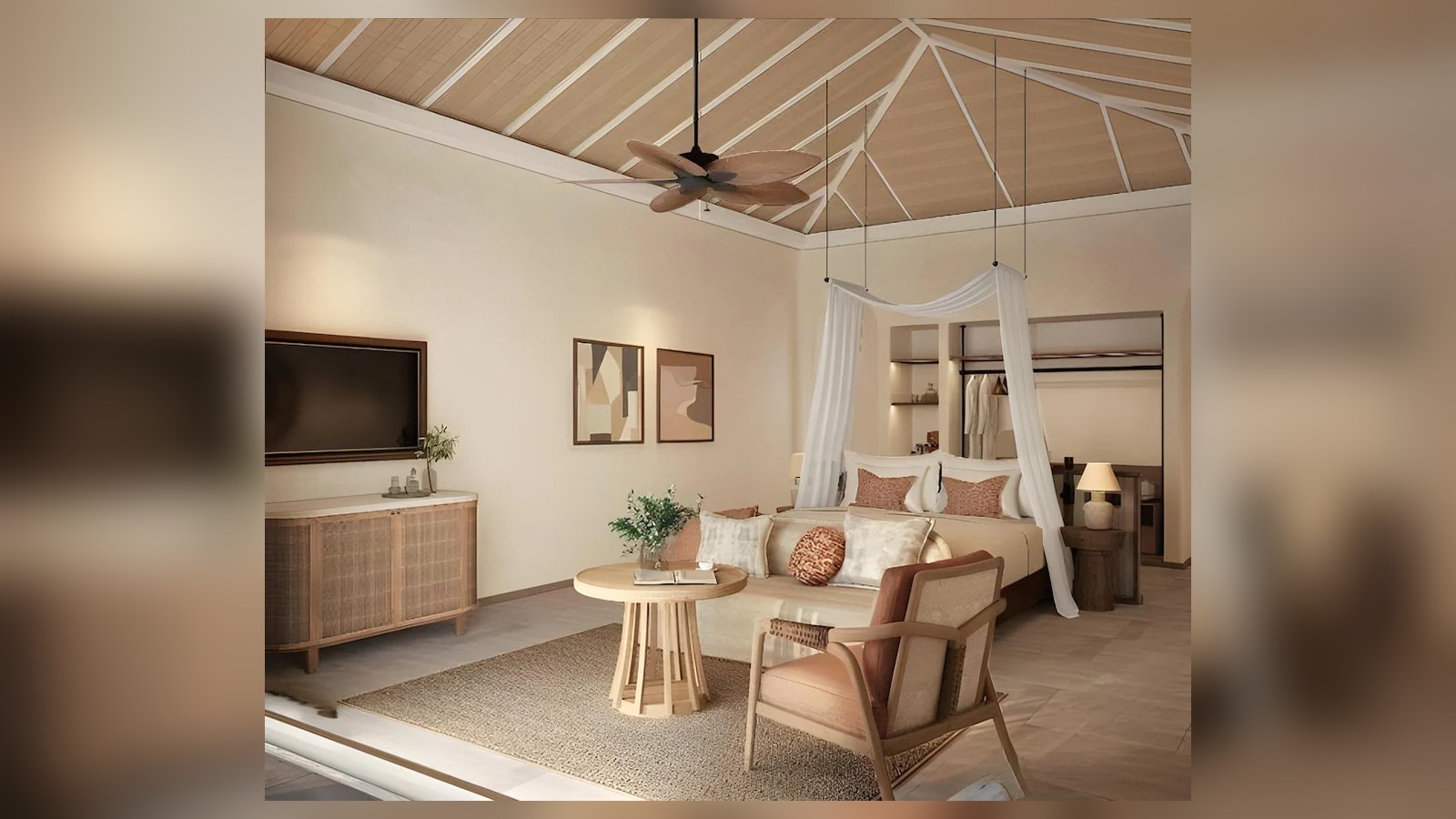 Giường màn, trần dốc và ghế mây tạo một phòng suite mang tinh thần nghỉ dưỡng bản địa.