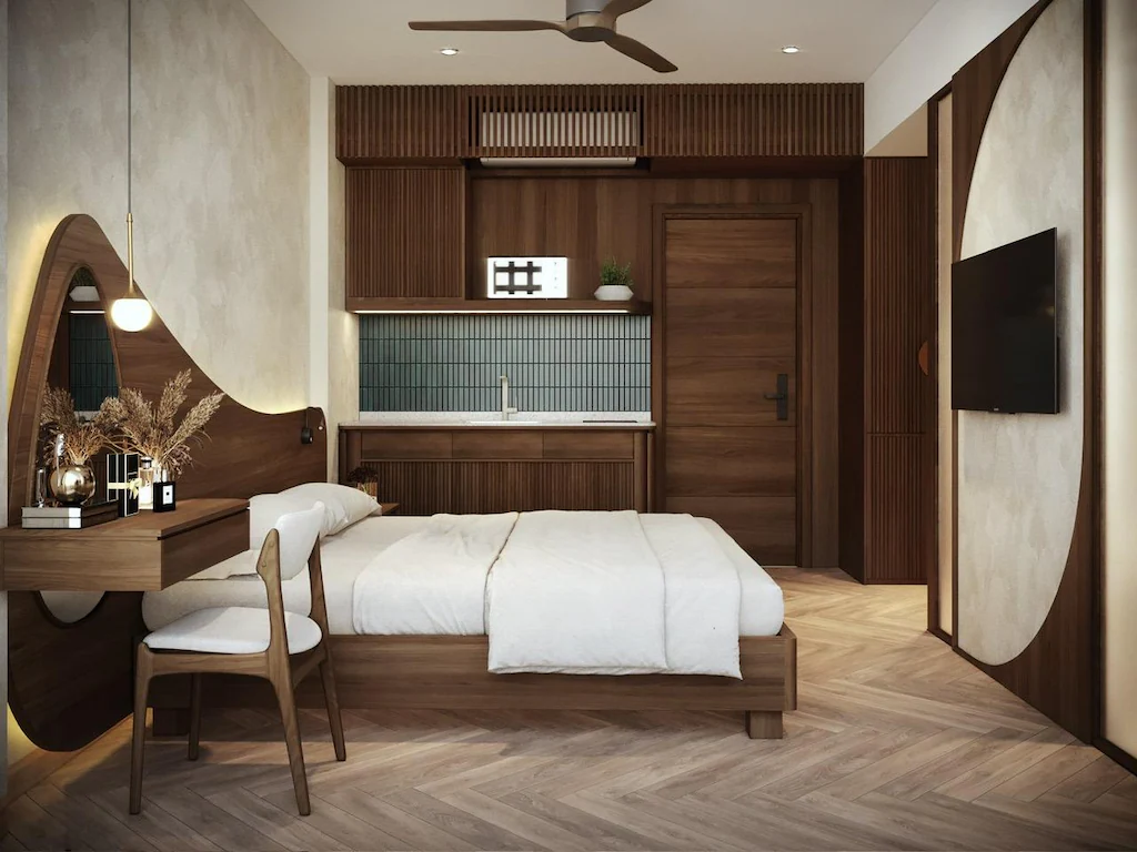 Phòng studio khách sạn 3 sao với giường gỗ, bàn làm việc, bếp nhỏ và đường cong trang trí