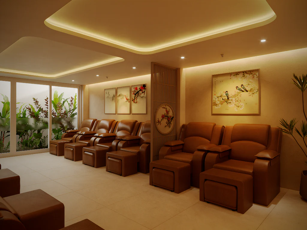 Phòng thư giãn spa khách sạn 3 sao với ghế massage, tranh trang trí và ánh sáng vàng